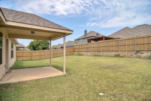 view of yard featuring a fenced backyard and a patio area