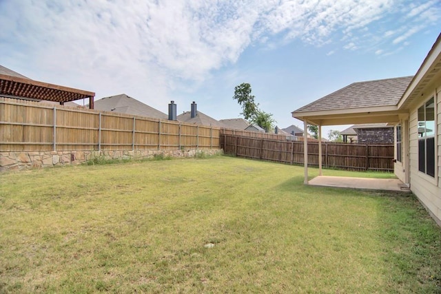 view of yard featuring a fenced backyard