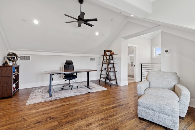 home office featuring visible vents, wood finished floors, baseboards, ceiling fan, and vaulted ceiling