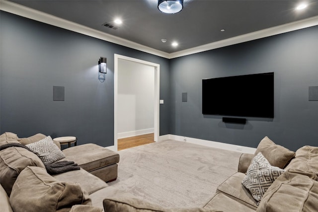 home theater room with visible vents, recessed lighting, carpet flooring, crown molding, and baseboards