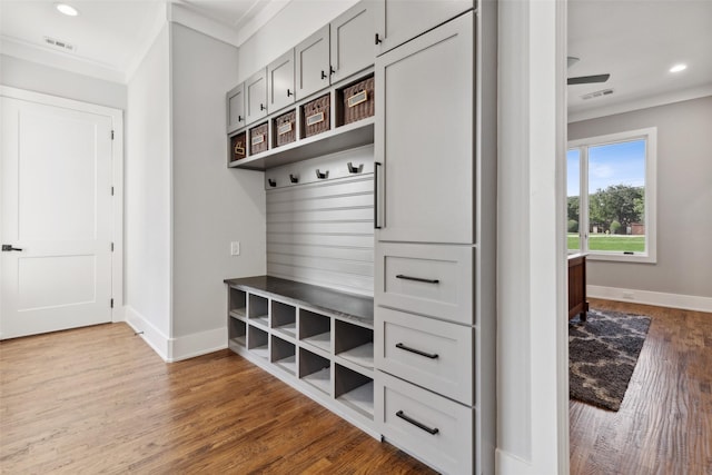 mudroom with wood finished floors, recessed lighting, baseboards, and visible vents