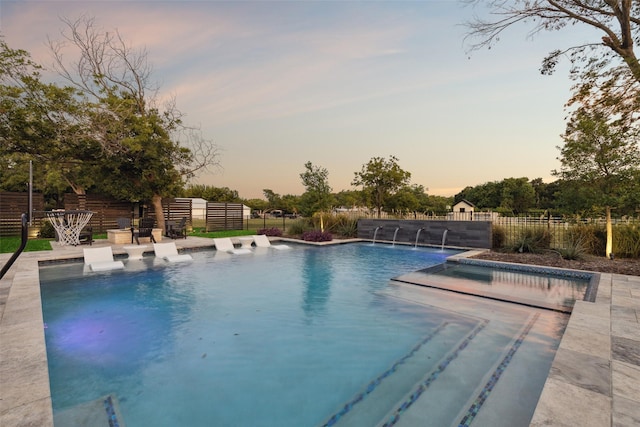 view of pool featuring a patio area, a fenced in pool, and fence