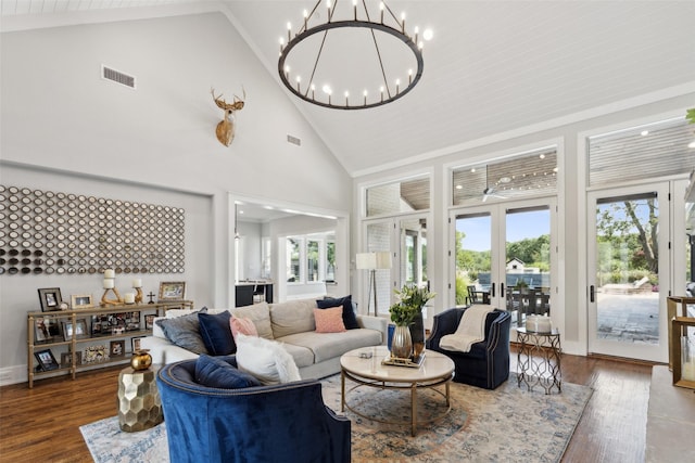 living room with visible vents, plenty of natural light, and wood finished floors