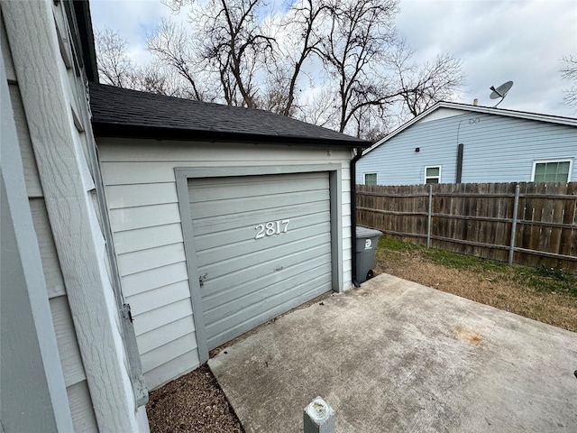 garage featuring fence