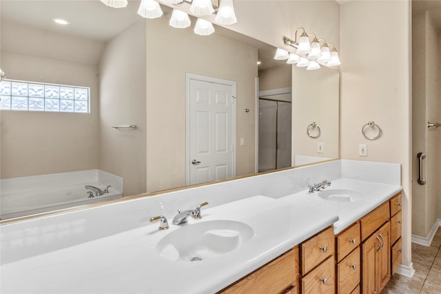 full bath with a sink, a chandelier, double vanity, and tile patterned floors