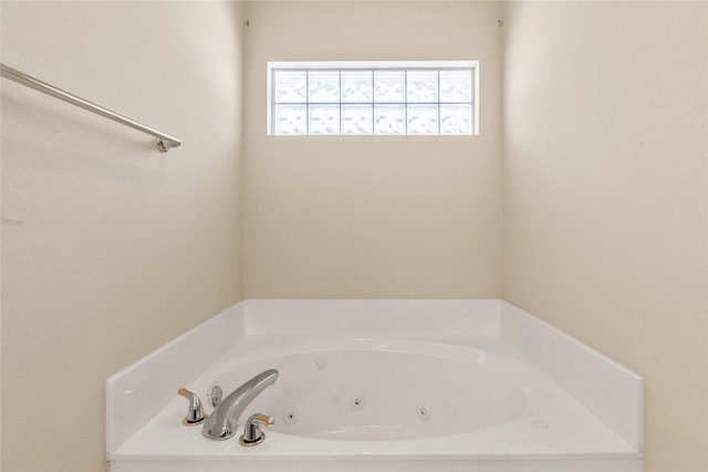 bathroom with a whirlpool tub