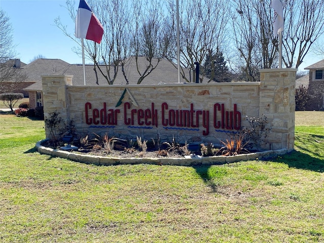 community sign with a lawn