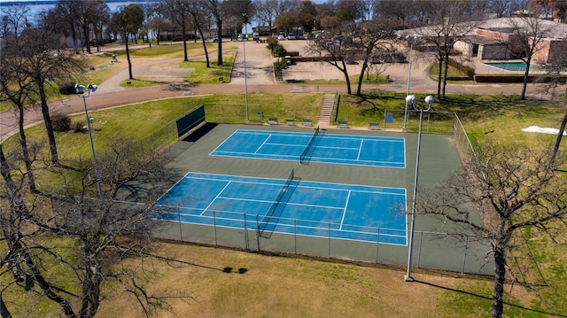 view of tennis court with fence