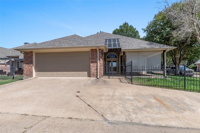 single story home featuring fence, driveway, a shingled roof, a garage, and brick siding