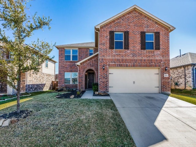 traditional-style home featuring a front lawn, an attached garage, brick siding, and driveway