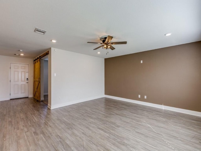 empty room with visible vents, light wood-style flooring, recessed lighting, baseboards, and ceiling fan