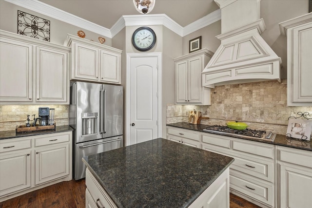 kitchen featuring dark wood finished floors, custom exhaust hood, ornamental molding, decorative backsplash, and stainless steel appliances