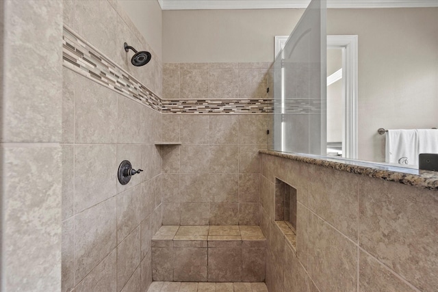 full bath featuring ornamental molding and a walk in shower