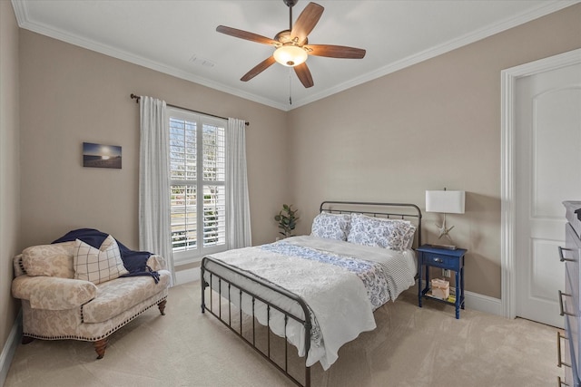 bedroom with visible vents, crown molding, ceiling fan, baseboards, and light carpet