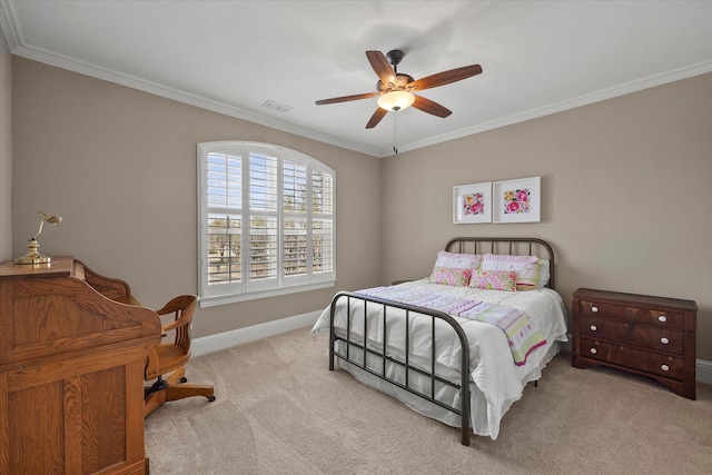 carpeted bedroom with visible vents, a ceiling fan, baseboards, and ornamental molding