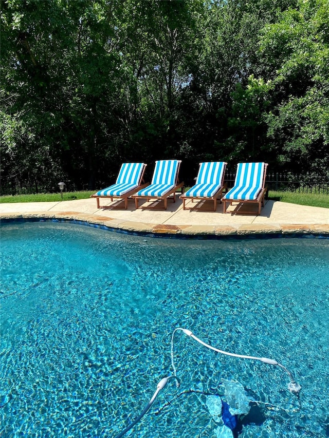 outdoor pool featuring a patio