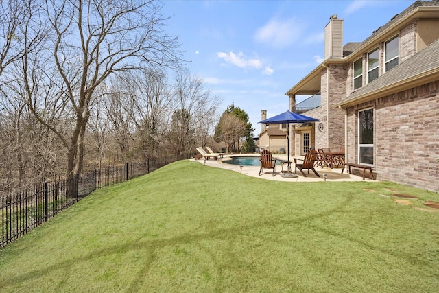 view of yard with a patio area, a fenced in pool, and a fenced backyard