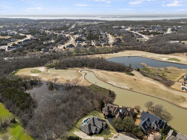 birds eye view of property featuring a water view and view of golf course