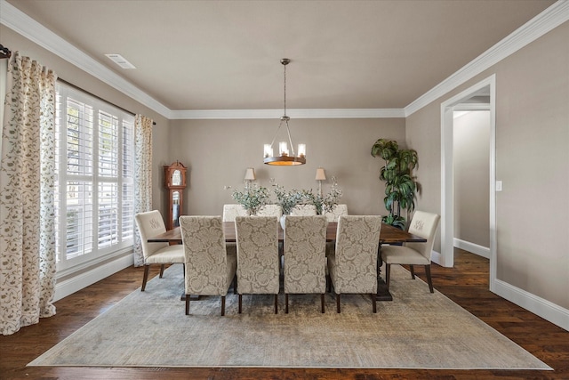 dining area with visible vents, baseboards, ornamental molding, dark wood-style floors, and a notable chandelier