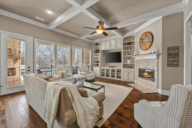 living room featuring beamed ceiling, a fireplace with flush hearth, coffered ceiling, dark wood-style floors, and ceiling fan