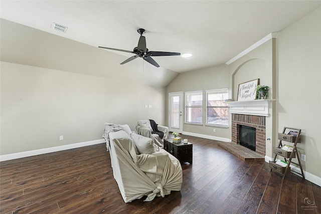 living room with baseboards, dark wood-type flooring, ceiling fan, and a fireplace