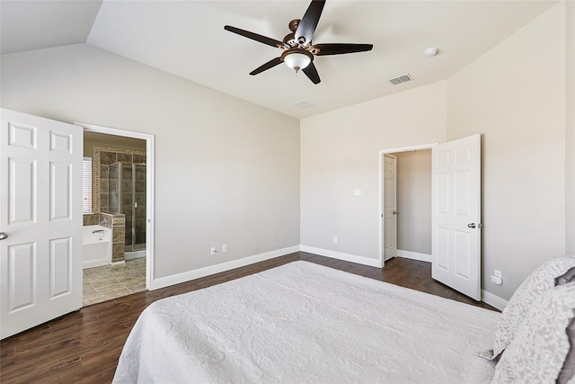 bedroom with visible vents, baseboards, dark wood-type flooring, and lofted ceiling