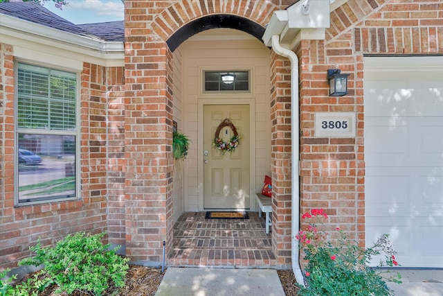 3805 Denridge Ln, Fort Worth, TX 76262 - entrance to property featuring brick siding, a shingled roof, and an attached garage