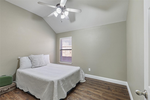 bedroom featuring baseboards, lofted ceiling, ceiling fan, and dark wood-style flooring