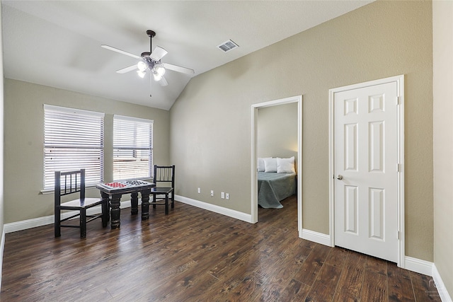 living area featuring visible vents, dark wood-type flooring, a ceiling fan, baseboards, and vaulted ceiling