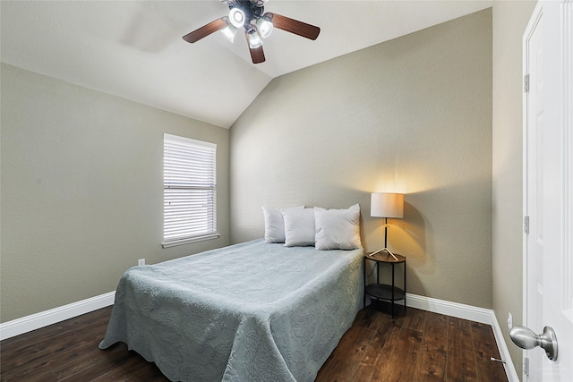 bedroom with ceiling fan, baseboards, lofted ceiling, and wood finished floors