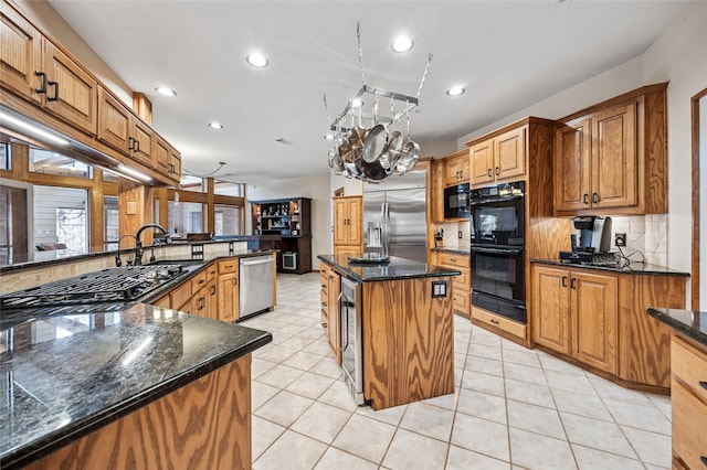 kitchen with black appliances, recessed lighting, backsplash, and dark stone counters