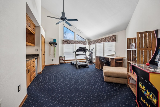 exercise area with track lighting, baseboards, ceiling fan, carpet floors, and high vaulted ceiling