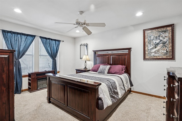 bedroom featuring recessed lighting, baseboards, light carpet, and a ceiling fan