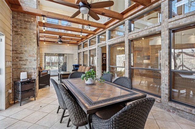 sunroom / solarium with ceiling fan