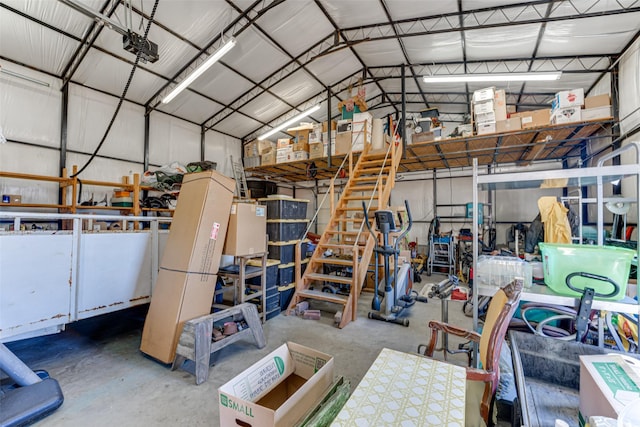 garage with metal wall and a garage door opener