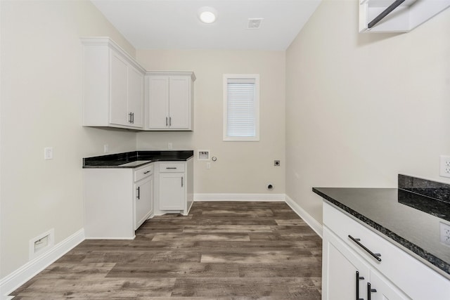 laundry area with baseboards, washer hookup, dark wood-style floors, cabinet space, and electric dryer hookup