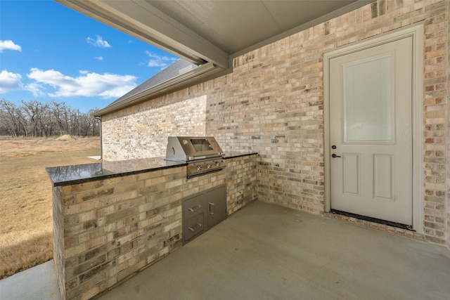 view of patio / terrace with a grill and exterior kitchen