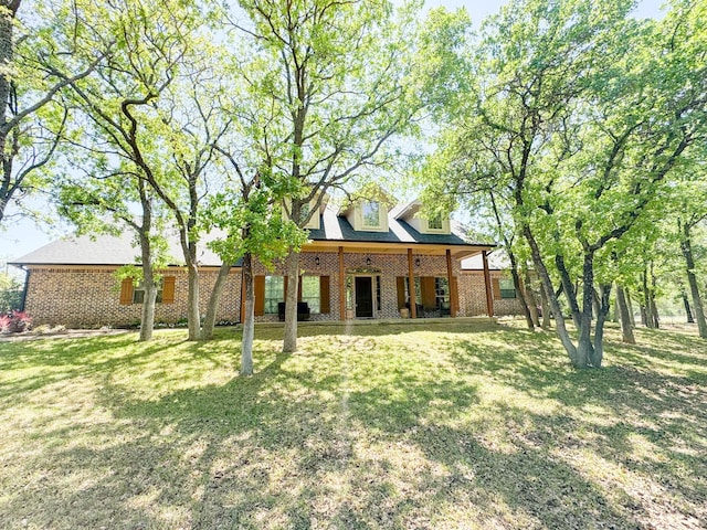 505 Spring Valley Rd, Paradise, TX 76073 - back of house featuring brick siding and a lawn