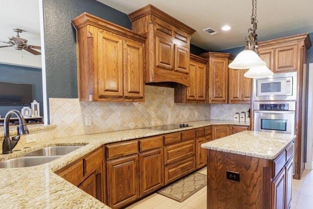 505 Spring Valley Rd, Paradise, TX 76073 - kitchen with black electric cooktop, oven, a sink, visible vents, and white microwave