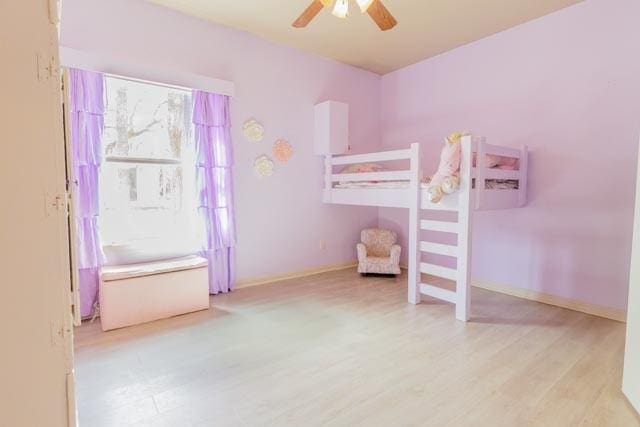 505 Spring Valley Rd, Paradise, TX 76073 - bedroom with wood finished floors, baseboards, and ceiling fan
