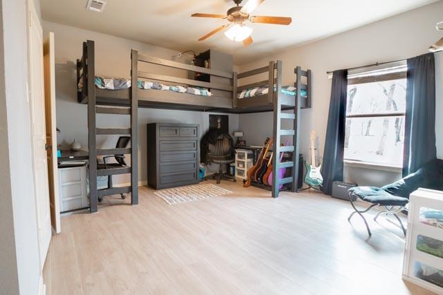 505 Spring Valley Rd, Paradise, TX 76073 - bedroom with wood finished floors and visible vents