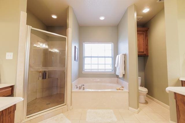 505 Spring Valley Rd, Paradise, TX 76073 - bathroom featuring a bath, toilet, vanity, and a stall shower