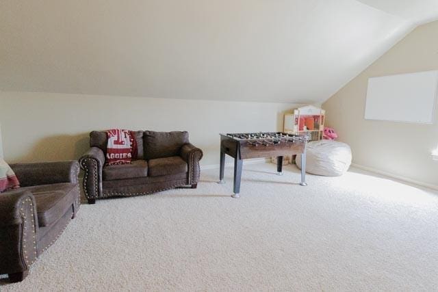 505 Spring Valley Rd, Paradise, TX 76073 - rec room with lofted ceiling, baseboards, and carpet flooring