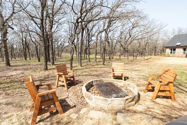 505 Spring Valley Rd, Paradise, TX 76073 - view of patio / terrace featuring an outdoor fire pit