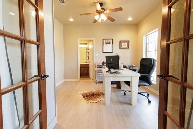 505 Spring Valley Rd, Paradise, TX 76073 - home office with french doors, light wood-style flooring, visible vents, baseboards, and a ceiling fan