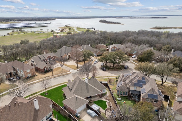 aerial view featuring a residential view and a water view