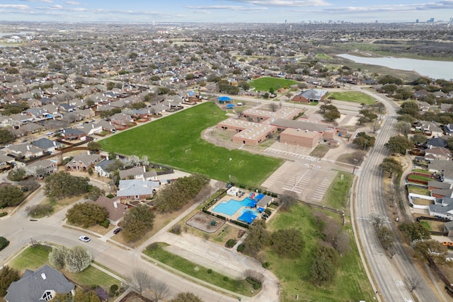 birds eye view of property featuring a residential view and a water view