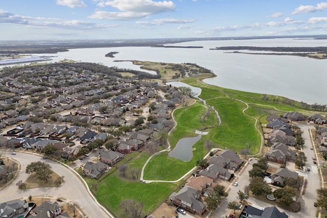 drone / aerial view with a residential view and a water view