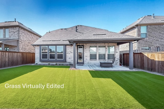 529 Hummingbird Dr, Celina, TX 75009 - back of house featuring brick siding, a yard, a patio, and a fenced backyard