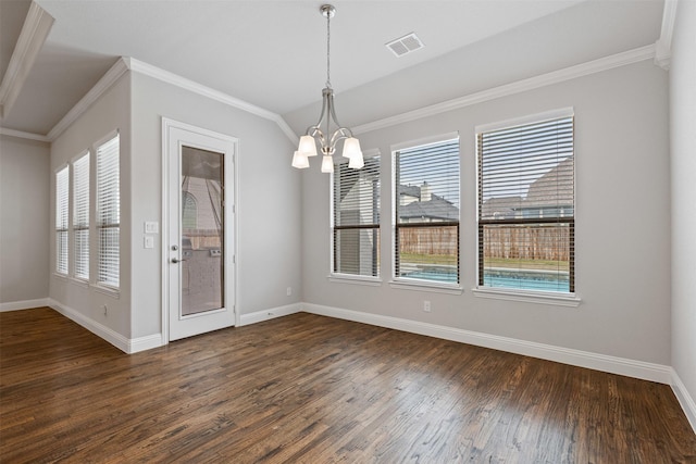 unfurnished dining area featuring visible vents, baseboards, dark wood-type flooring, crown molding, and a notable chandelier